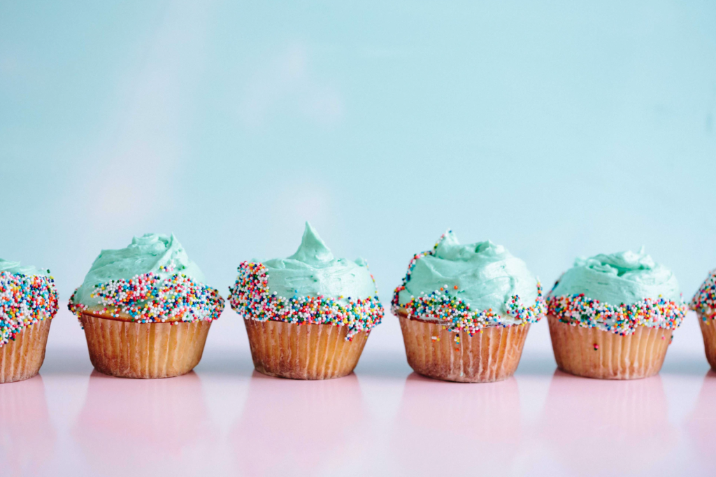 Six cupcakes with frosting, food science microscopy in action